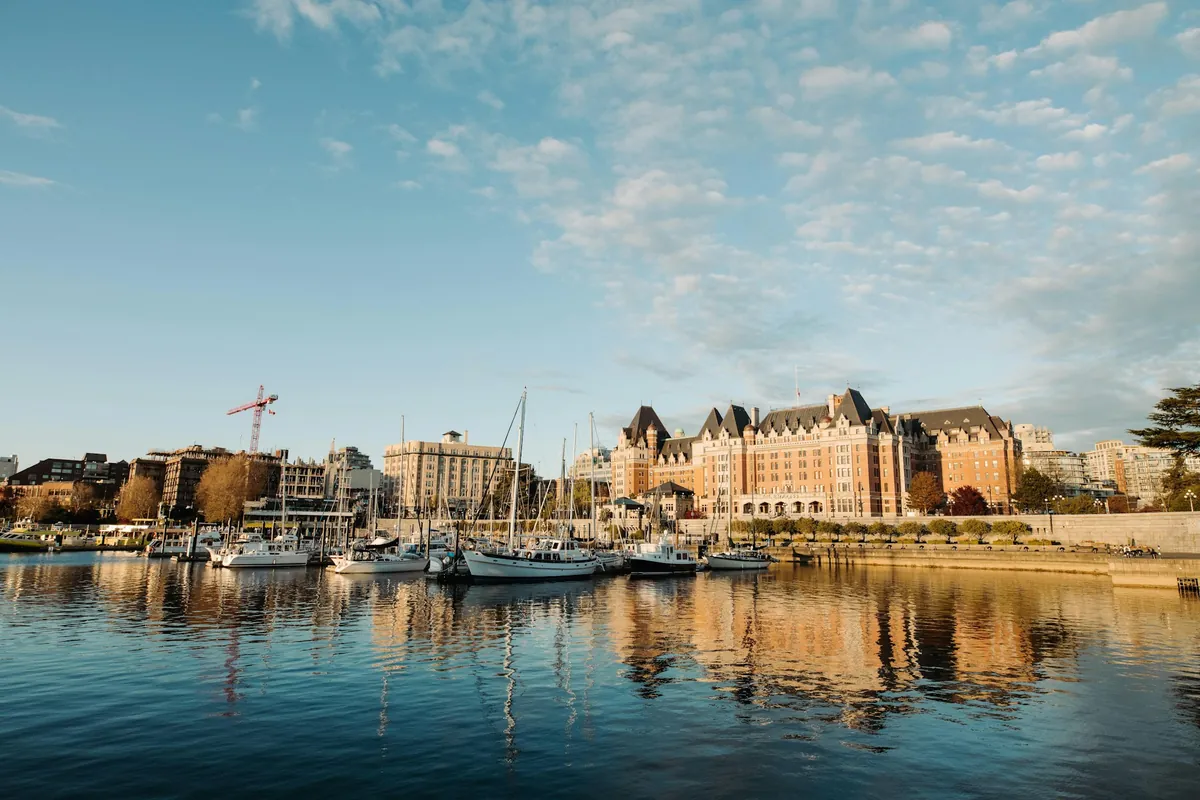 Boats in the Inner Harbour in Victoria, with the Empress hotel behind them
